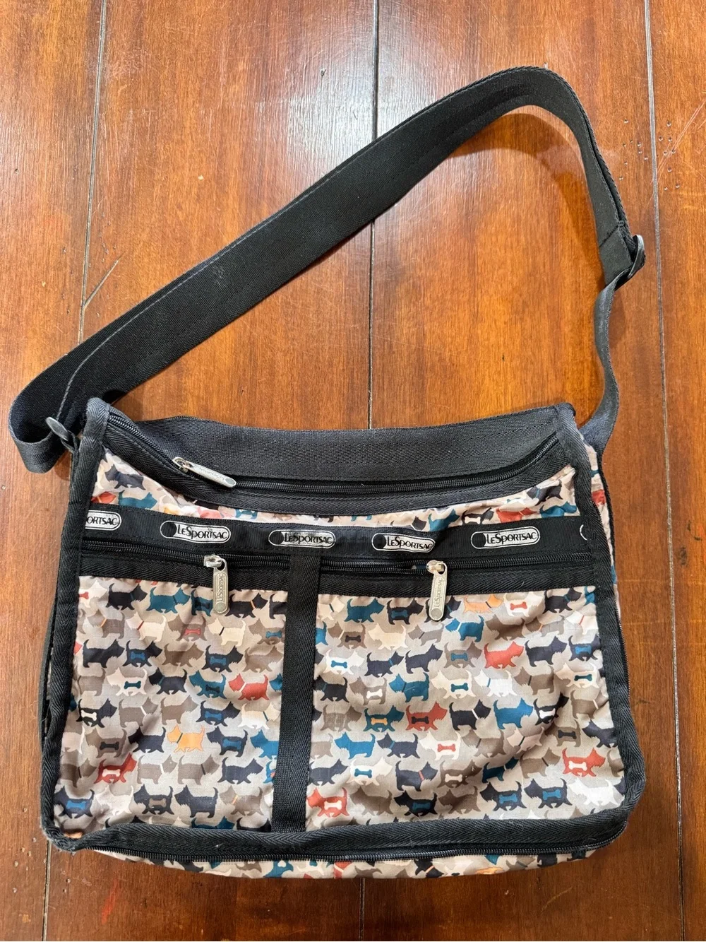 LeSportsac Multi-Dog Print Crossbody in Beige, Blue, Black & Red Accents